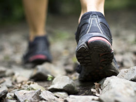 Sport shoes on trail walking in mountains