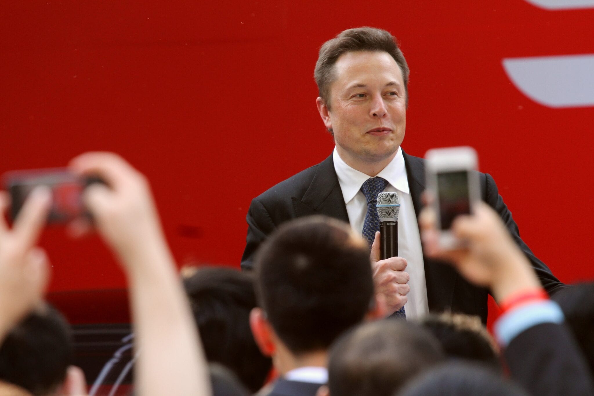 Elon Musk, CEO of Tesla Motors Inc., speaks during a delivery ceremony for Tesla Model S sedan in Beijing, China, 22 April 2014. Tesla Motors Inc. began deliveries of the Model S sedan in China as Chief Executive Officer Elon Musk tested the reluctance of consumers in the worlds largest auto market to buy electric cars. The billionaire chairman hosted an event on Tuesday (22 April 2014) to mark the occasion, according to the Palo Alto, California-based company. The electric-car maker has been taking orders since August and opened an 800-square-meter (8,600 square feet) store in a Beijing shopping mall late last year to showcase its vehicles.