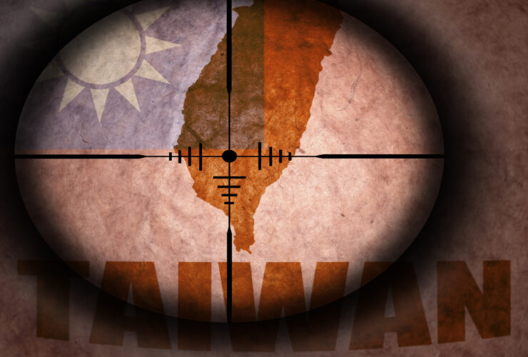 sniper scope aimed at the vintage taiwan flag and map