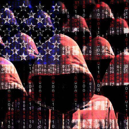 Group of hooded men shining through a digital american flag