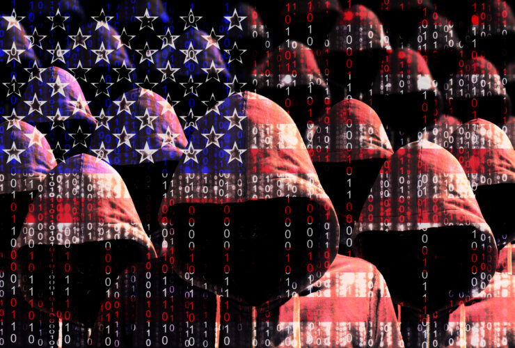 Group of hooded men shining through a digital american flag